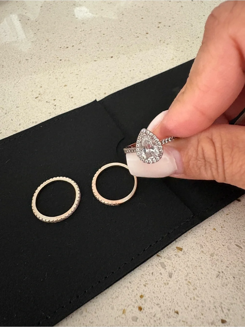 Pear-Shaped Halo Ring with Clear Cubic Stones in Silver